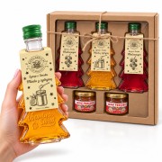 Zestaw prezentowy: 2× malina (gładka) + 1× miód z cytryną (Wesołych Świąt) + 2 miody – miniatura, butelka w dłoni